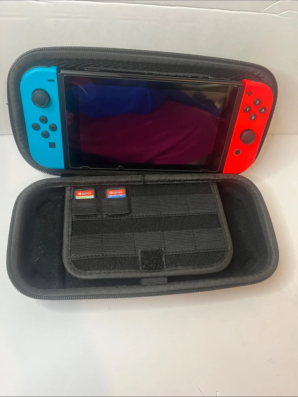 Nintendo Switch with Neon Red & Neon Blue Joy-Con, Case and Accessories